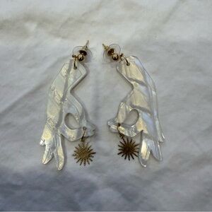 Hands Holding Sun Charm Earrings